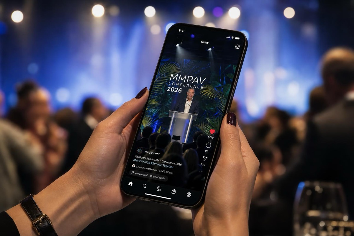 Camera capturing a high-energy conference keynote moment for a highlight reel