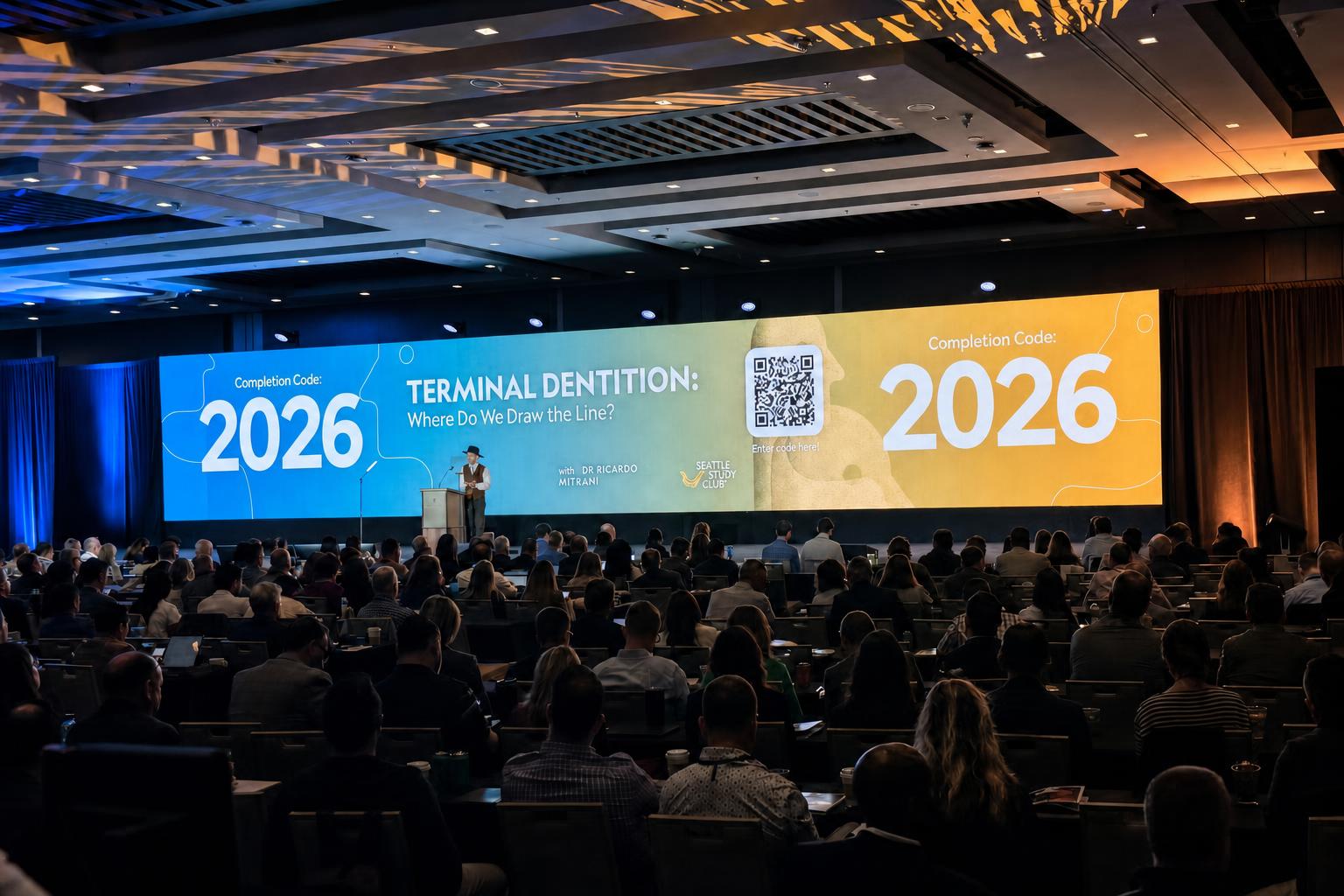 Corporate conference stage with lighting rig and seated audience