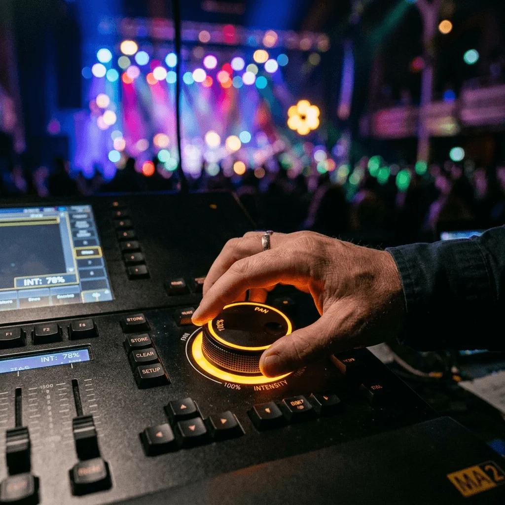Audio engineer running soundcheck with presenter before event